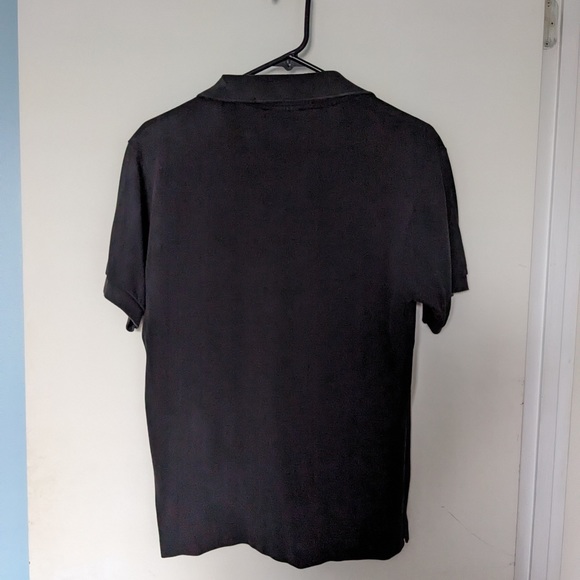 Lacoste black polos shirt size 3, damaged from the inside near the buttons - Picture 2 of 4